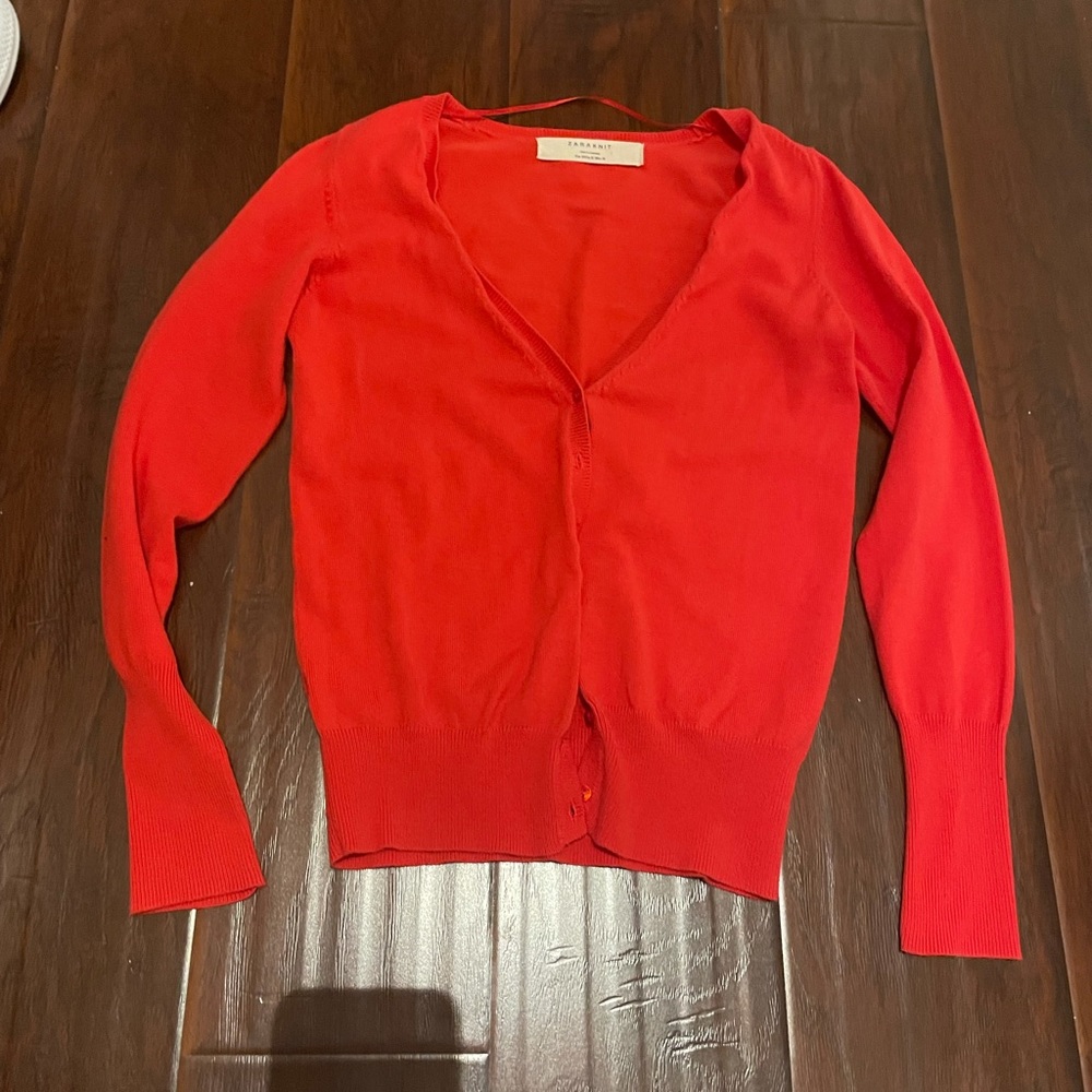Red button up sweater